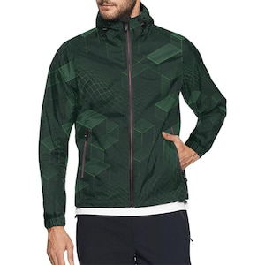May include: Dark green hooded jacket with a geometric cube pattern. The jacket features a full-length zipper, two side pockets, and a drawstring hood. The design includes a grid-like pattern and red zipper accents.