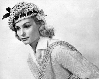 May include: A woman wearing a white crocheted hat with a black bow and a crocheted shoulder bag.