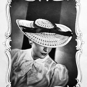 May include: A black and white photo of a woman wearing a large, white, crocheted sun hat with a black ribbon. The woman is looking down and her face is partially obscured by the hat.