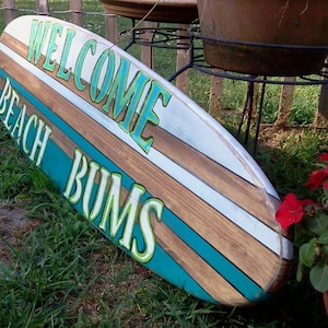 Distressed surfboard wall hanging, Welcome Beach Bums surfboard wall art