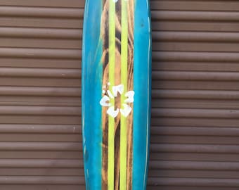 Distressed surfboard wall art. Teal with lime green.