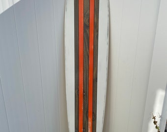 Distressed surfboard wall art. White with orange stripes. Surfboard wall art.