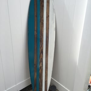 Distressed surfboard wall art.