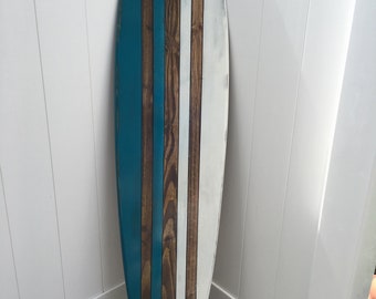 Distressed surfboard wall art.