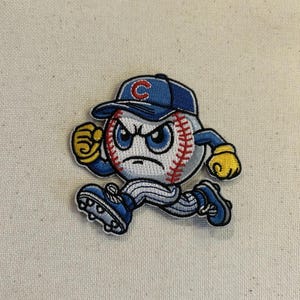 May include: Embroidered patch featuring a baseball character with an angry expression. The baseball wears a blue cap with a red "C" and has blue eyes, red stitching, and yellow gloves. The character is running with blue shoes.