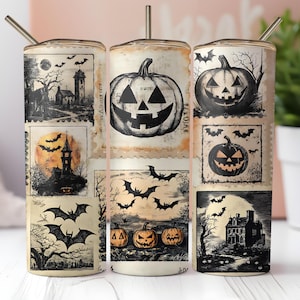 May include: A set of three Halloween-themed tumblers with stainless steel straws. Each tumbler features a collage of vintage-style illustrations, including jack-o'-lanterns, bats, haunted houses, and full moons. The color palette is primarily black and cream.