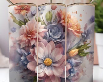 Op de afbeelding: Drie roestvrijstalen bekers met een bloemenmotief. De bekers tonen een aquarel-achtige afbeelding van roze, blauwe en gele bloemen.