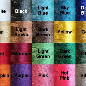 May include: A grid of twenty square swatches showing various thread colors, each labeled with its name: White, Black, Light Blue, Sky Blue, Dark Blue, Tan, Light Brown, Dark Brown, Yellow, Gold, Red, Maroon, Light Green, Dark Green, Olive, Pumpkin, Purple, Pink, Hot Pink, and Silver.