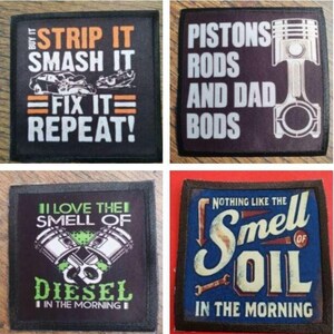 May include: Four black-bordered square patches with white text and colourful graphics. The first patch says "Strip it Smash it Fix it Repeat!" with a car graphic. The second patch says "Pistons Rods and Dad Bods" with a piston graphic. The third patch says "I Love the Smell of Diesel in the Morning" with a green and white piston graphic. The fourth patch says "Nothing Like the Smell of Oil in the Morning" with a blue, yellow, and orange graphic.