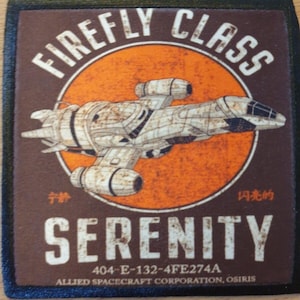 May include: A brown and black patch with a distressed look featuring a spaceship in the centre with the text "FIREFLY CLASS" above it and "SERENITY" below it. The text "404-E-132-4FE274A" and "ALLIED SPACECRAFT CORPORATION, OSIRIS" are also included on the patch.