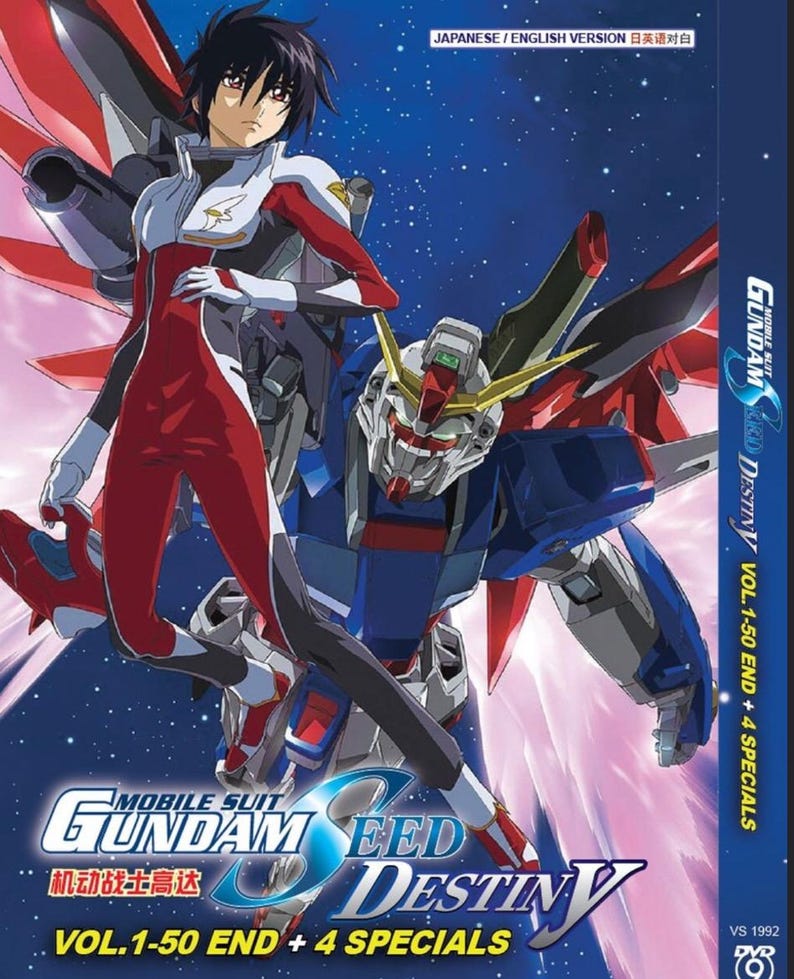 K&ouml;nnte beinhalten: DVD-H&uuml;lle mit Anime-Charakteren und einem riesigen Roboter. Das Cover zeigt eine Person in einem rot-wei&szlig;en Anzug und einen blauen, roten und wei&szlig;en Roboter. Der Titel "MOBILE SUIT GUNDAM SEED DESTINY" ist mit japanischem Text versehen. Das DVD-Set enth&auml;lt Vol. 1-50 und 4 Specials.