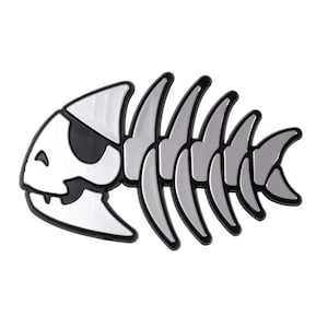 May include: A silver-colored fish skeleton with a black eye patch. The fish is facing right and has a detailed, stylized design.