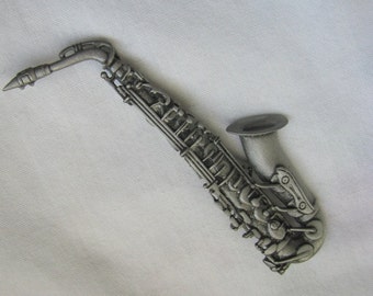 Pewter tone detailed sax instrument brooch pin by JJ