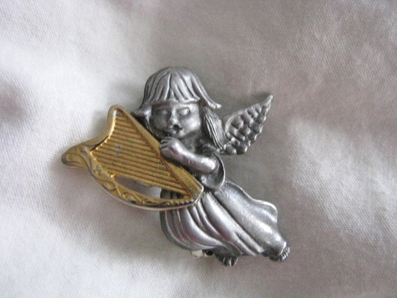 Adorable vintage Christmas angel Pewter angel girl blowing a gold tone trumpet signed Daria designer brooch