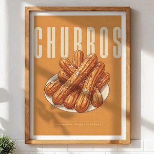 May include: A framed print featuring the word "CHURROS" in large white letters above an illustration of churros dusted with sugar on a white plate. The background is a warm orange color.