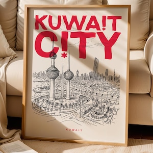 May include: A framed art print with a black and white illustration of Kuwait City, with the text "KUWAIT CITY" in red. The print depicts the Kuwait Towers and cityscape, with the word "KUWAIT" below. The artwork is displayed near a beige sofa.