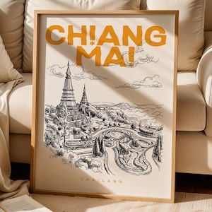May include: A framed wall art print featuring a black ink line drawing of a temple complex in Chiang Mai, Thailand. The text CHIANG MAI is printed in large, bold yellow letters at the top, with the word THAILAND in smaller yellow letters at the bottom.