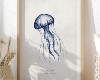 May include: A framed watercolor print of a jellyfish in shades of blue. The artwork features the word "JELLYFISH" and the scientific name "Aurelia Aurita" in a minimalist style. The print is displayed in a light wood frame.