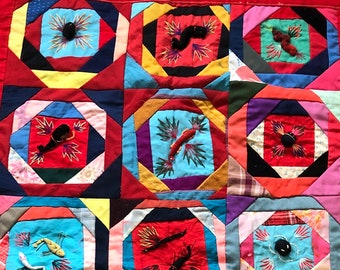 Vintage handmade quilt, unusual ornate with insects