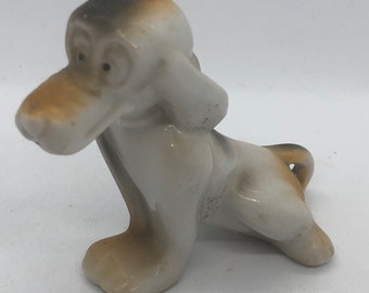 Vintage flat billed dog figurine