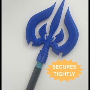 May include: A blue trident prop with a dark gray handle. The trident head has three prongs and a decorative design. The text "SECURES TIGHTLY" is on a yellow starburst.