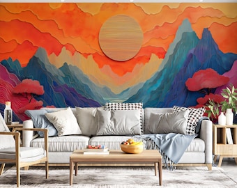 Könnte beinhalten: Ein Wohnzimmer mit einem lebendigen, abstrakten Bergwandbild in Orange-, Rot- und Blautönen. Vor dem Wandbild steht ein helles Sofa mit grauen und gemusterten Kissen. Ein Couchtisch und ein Beistelltisch aus Holz vervollständigen die Einrichtung.