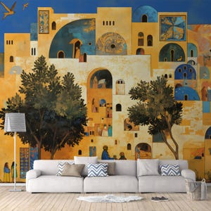 May include: A large mural depicting a stylized Middle Eastern village scene with yellow and blue buildings, arched doorways, and trees. A white sofa with decorative pillows sits in front of the mural. A floor lamp and a woven basket are also visible.