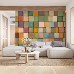 May include: A modern living room featuring a white sectional sofa, a round wooden coffee table, and a textured rug. The focal point is a wall decorated with colorful square tiles in shades of orange, green, yellow, and purple.
