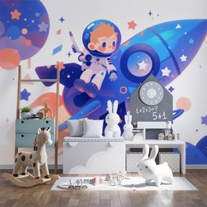 Carta da parati murale con astronauta e razzo nella cameretta dei bambini / Astronauta e razzo blu, viola e arancione | Vivawalls