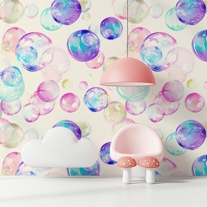May include: A whimsical interior scene featuring a light pink chair, two mushroom-shaped stools, and a cloud-shaped wall decoration. The background is a wallpaper with colorful bubble illustrations. A pink pendant lamp hangs from the ceiling.