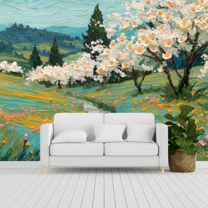 May include: A white two-seater sofa positioned against a wall mural depicting an oil painting of a landscape with white flowering trees, green rolling hills, dark evergreen trees, and a field of yellow and pink wildflowers under a light blue sky.