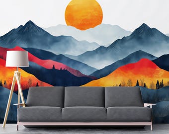 Könnte beinhalten: Ein graues Sofa mit rosa Sockel und eine hölzerne Stehlampe mit weißem Lampenschirm. Der Hintergrund ist ein Berglandschaftsmural mit einer großen orangefarbenen Sonne, blauen Bergen und roten und gelben Hügeln.