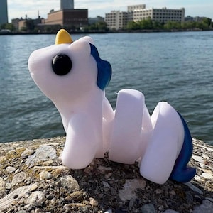 Articulated Baby Unicorn Figurine 3D Printed Flexi Toy by Zou3D