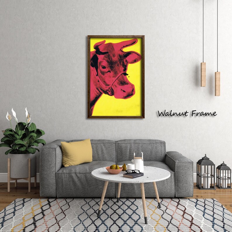May include: A framed pop art print featuring a red cow against a yellow background. The artwork is in a walnut frame and is displayed in a living room setting. The text "Walnut Frame" is visible on the wall.