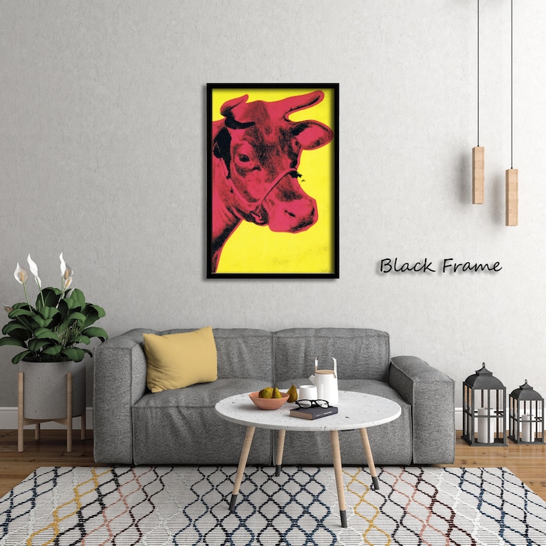 May include: A framed pop art print featuring a red cow's head against a yellow background. The cow is in profile, with a black frame. The text "Black Frame" is below the artwork.