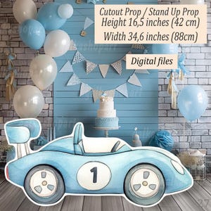 May include: A light blue cutout race car prop with the number 1 on the side. The prop is 16.5 inches (42 cm) tall and 34.6 inches (88cm) wide. The background includes balloons, a cake, and a banner, creating a festive atmosphere.
