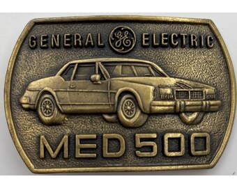 Hebilla de cinturón de latón vintage General Electric MED 500 de 1979, premio de seguridad GE Car Design