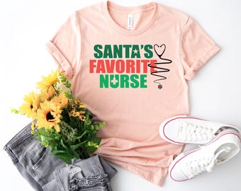 Santa’s Favorite Nurse T-Shirt – Funny Christmas Gift for Nurses, Holiday Graphic Tee, Cute Nurse Shirt for Holiday Season, Etsy Bestseller