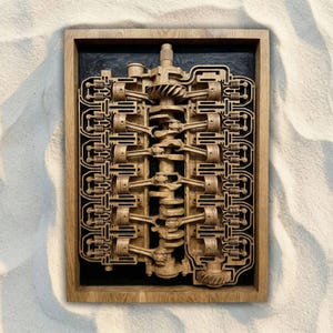 May include: A wooden framed relief sculpture of an engine's internal components. The detailed artwork showcases pistons, crankshaft, and other mechanical parts in a cross-section view. The frame is a light brown color, and the background is black.
