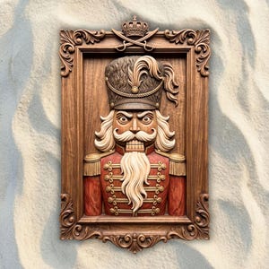 May include: A rectangular wooden wall plaque featuring a carved nutcracker soldier in a red uniform with gold accents, a tall hat with a feather, and a long white beard. The piece is encased in an ornate, dark brown carved wooden frame with a crown.