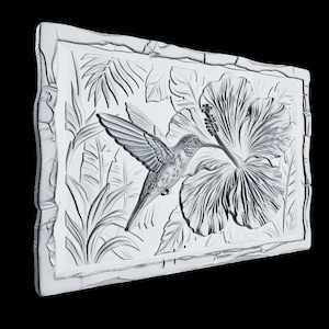 May include: A rectangular white wall plaque featuring a detailed relief carving of a hummingbird hovering near a large hibiscus flower, surrounded by tropical foliage. The piece is framed by a textured border with a carved bamboo-like appearance.
