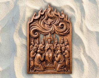 May include: A rectangular brown wood carving depicting the Pentecost scene. A central figure sits surrounded by twelve individuals, each with a flame above their head. A dove is carved at the top, with swirling flame patterns filling the upper arch.