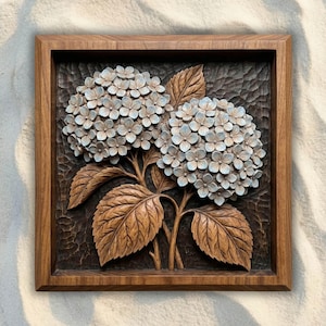 May include: A square wooden wall art piece featuring a detailed relief carving of two hydrangea flower clusters with light blue petals and brown leaves. The background has a dark, textured finish, and the entire carving is framed in wood.