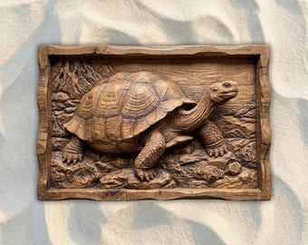 May include: A detailed wooden carving of a tortoise in a rectangular frame. The tortoise is brown with a textured shell and detailed legs and head. The frame has a rustic, natural wood grain appearance, adding to the piece's earthy aesthetic.