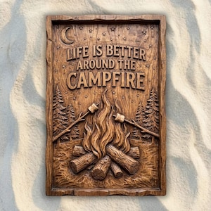May include: A rectangular wooden wall plaque with a carved relief design featuring a campfire with two roasting sticks, pine trees, stars, and a crescent moon. The text "LIFE IS BETTER AROUND THE CAMPFIRE" is carved into the upper section.
