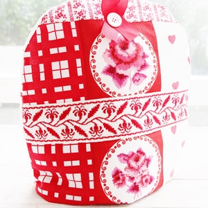 Cozy is decorated with wide floral vintage ribbon, button and satin ribbon.