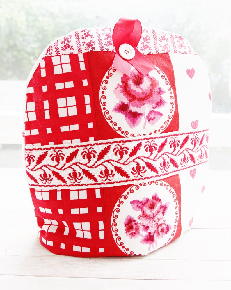 Cozy is decorated with wide floral vintage ribbon, button and satin ribbon.