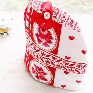 Detail of red and white cotton with hearts.