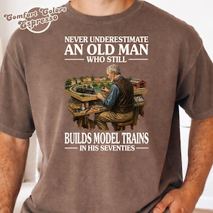 Never Underestimate an Old Man Who Still Builds Model Trains T-Shirt, Funny Grandpa Gift Birthday, 70s shirts for Mens, Railroad Hobby shirt