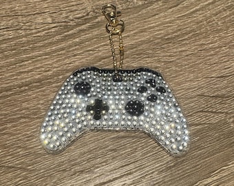 Llavero de doble cara con mando de juego